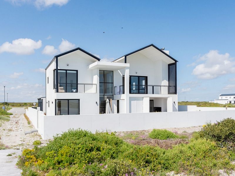 Coastal Luxury Redefined – Designer Beachfront Home with Panoramic Ocean Views - Photo 2