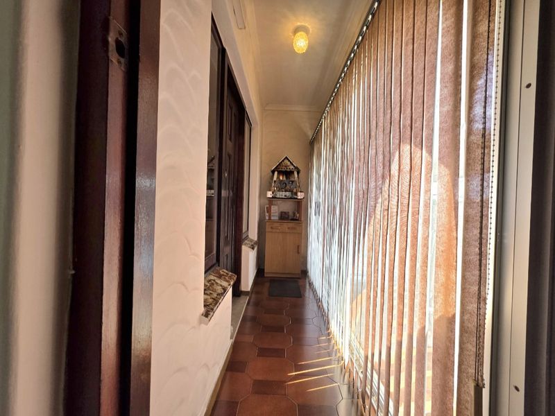 Elegant Double-Storey Residence with Dual Living Options and Coastal Convenience - Photo 9