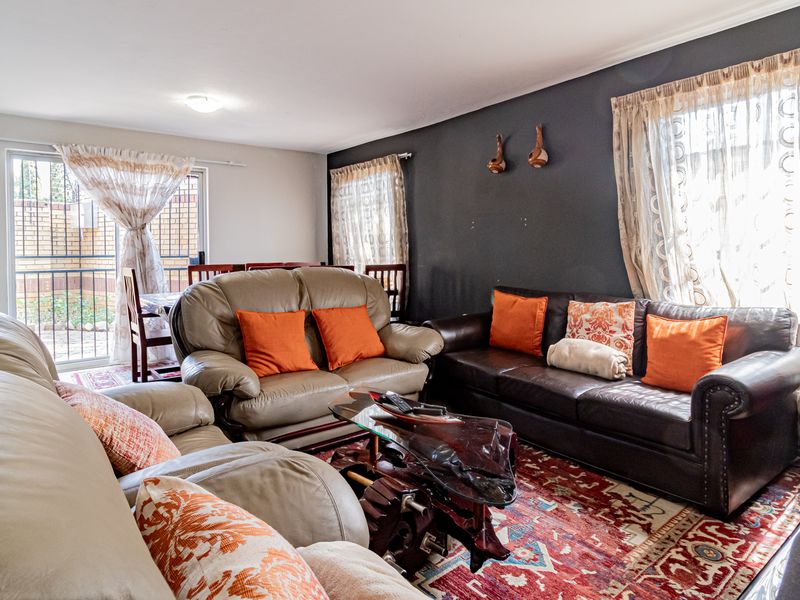 A comfortable living room featuring a sliding glass door that provides natural light and access to the outdoor area.