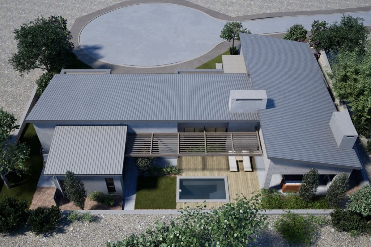 Aerial view of a modern residential property featuring a metal roof, swimming pool, timber deck, and pergola.