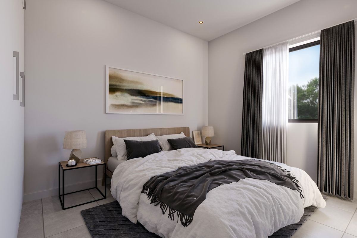 A modern, well-lit bedroom featuring tiled flooring, recessed downlighting, and a built-in wardrobe with a neutral color palette.