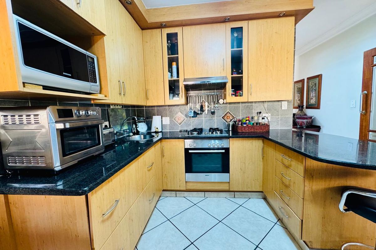 Flawlessly Maintained 4-Bedroom Estate Home with Private Garden and Pool - Photo 2