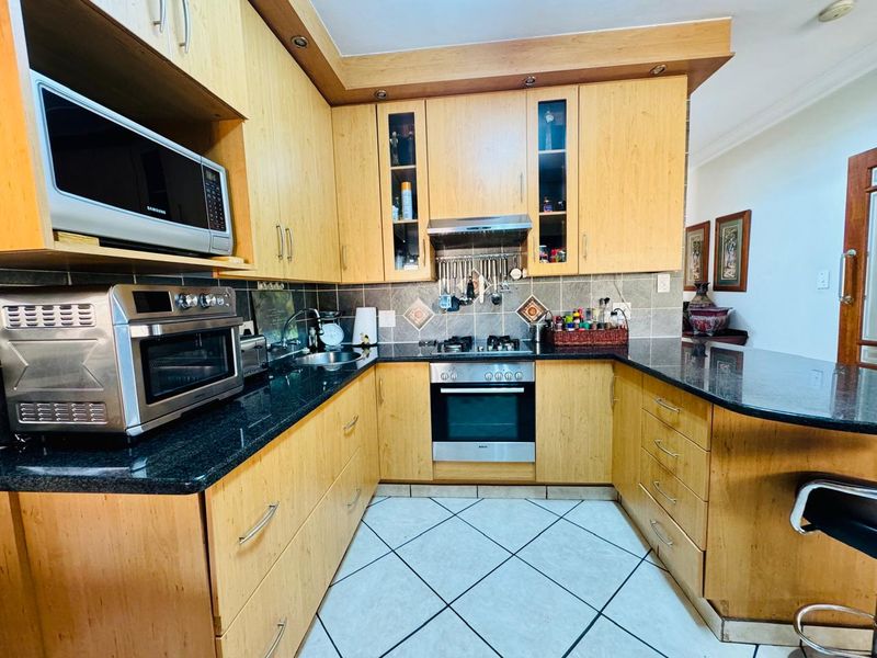 Flawlessly Maintained 4-Bedroom Estate Home with Private Garden and Pool - Photo 2