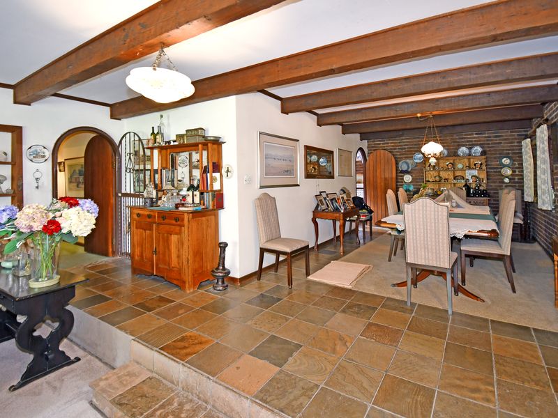 Beautifully landscaped garden property with a main home, cottage, and stables - Photo 4