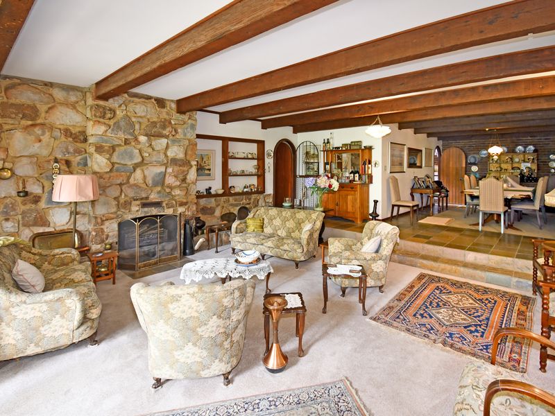 Beautifully landscaped garden property with a main home, cottage, and stables - Photo 9