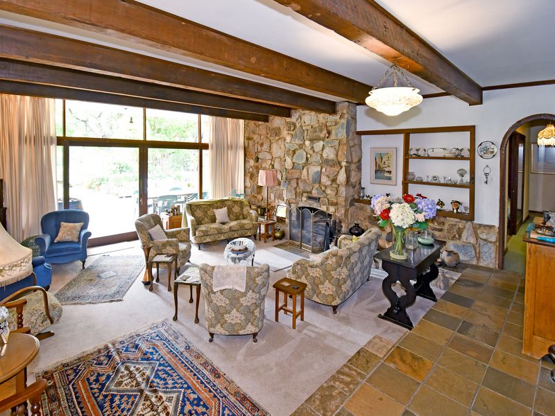 Beautifully landscaped garden property with a main home, cottage, and stables - Photo 8