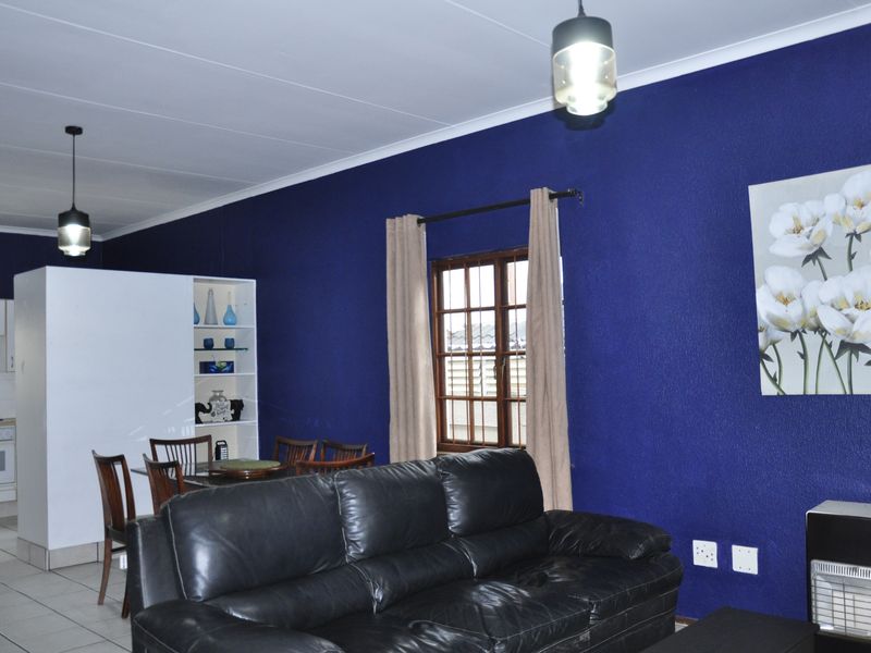 Cozy Full-Title Gem with Spacious Garden in the Heart of Halfway Gardens - Photo 2