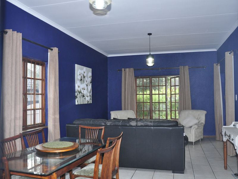 Cozy Full-Title Gem with Spacious Garden in the Heart of Halfway Gardens - Photo 3