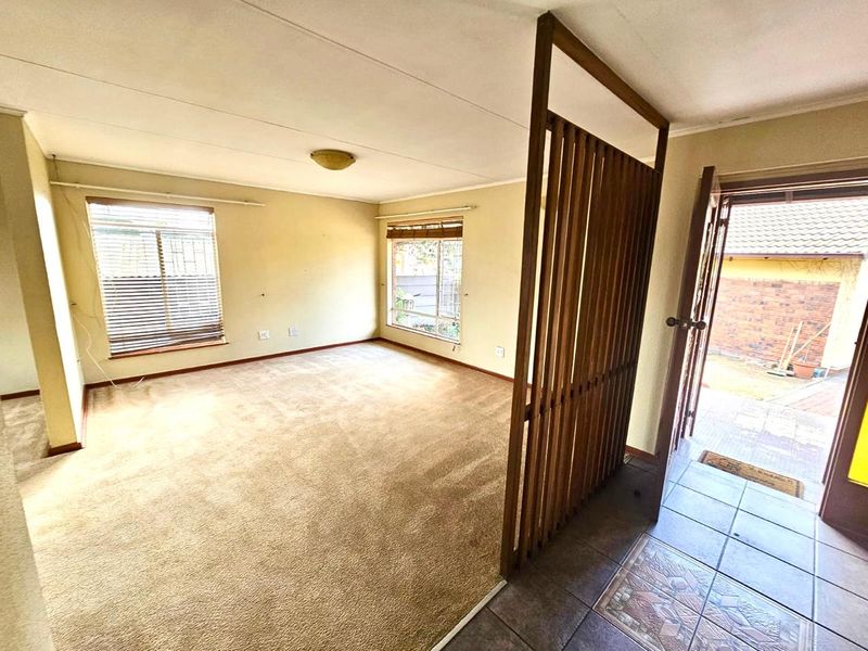 Strong, Spacious Family Home with Lapa, Braai and double garages for sale in Secunda - Photo 4