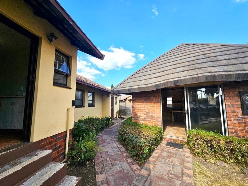 Strong, Spacious Family Home with Lapa, Braai and double garages for sale in Secunda - Photo 1