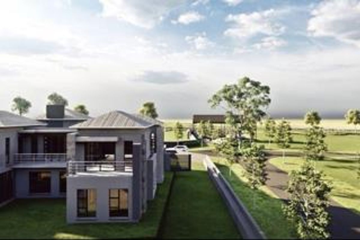 An aerial perspective of a modern residential property featuring expansive landscaped grounds, paved driveways, and a multi-level architectural design.