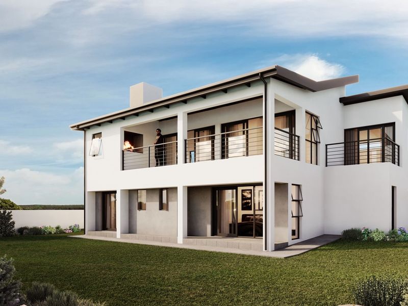 Rear view of a modern two-story house featuring a spacious upper balcony with a built-in braai and large sliding doors leading to the garden.