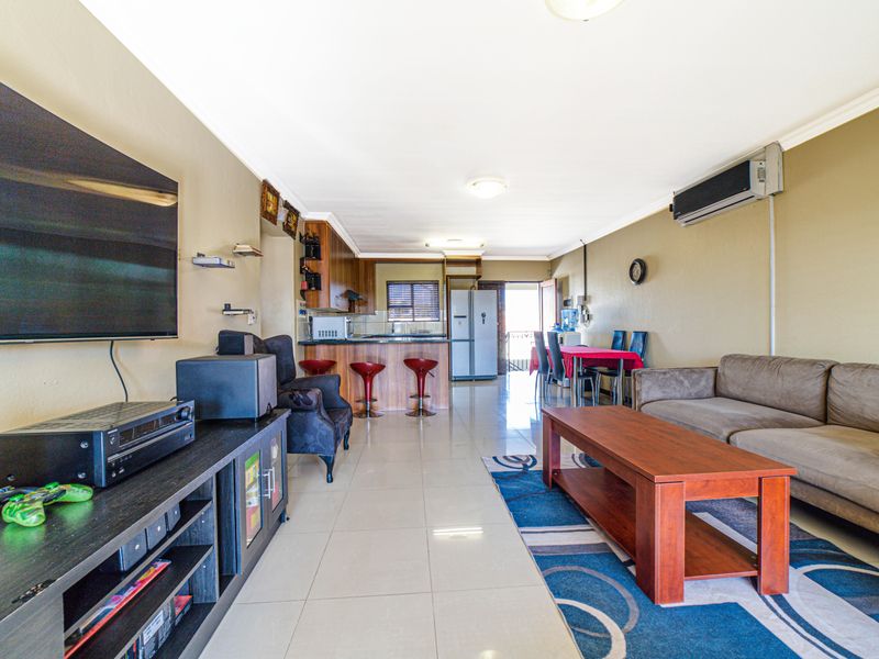 Step into elevated living with this beautifully positioned top-floor apartment in Olive Grove, Barbe - Photo 8