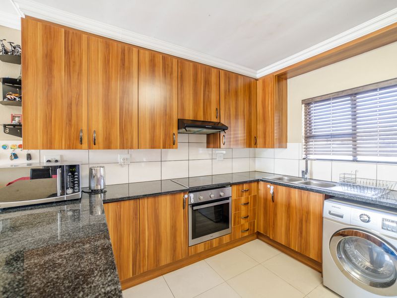 Step into elevated living with this beautifully positioned top-floor apartment in Olive Grove, Barbe - Photo 4
