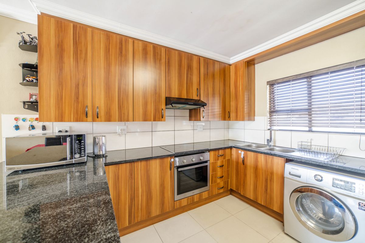 Step into elevated living with this beautifully positioned top-floor apartment in Olive Grove, Barbe - Photo 4