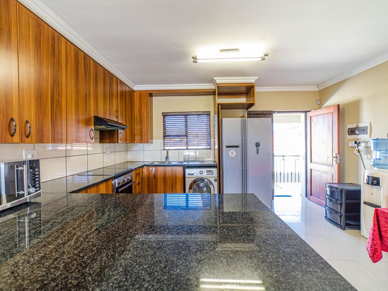 Step into elevated living with this beautifully positioned top-floor apartment in Olive Grove, Barbe - Photo 3