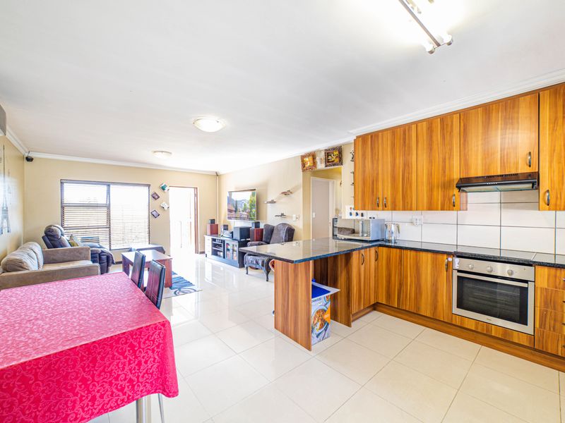Step into elevated living with this beautifully positioned top-floor apartment in Olive Grove, Barbe - Photo 2