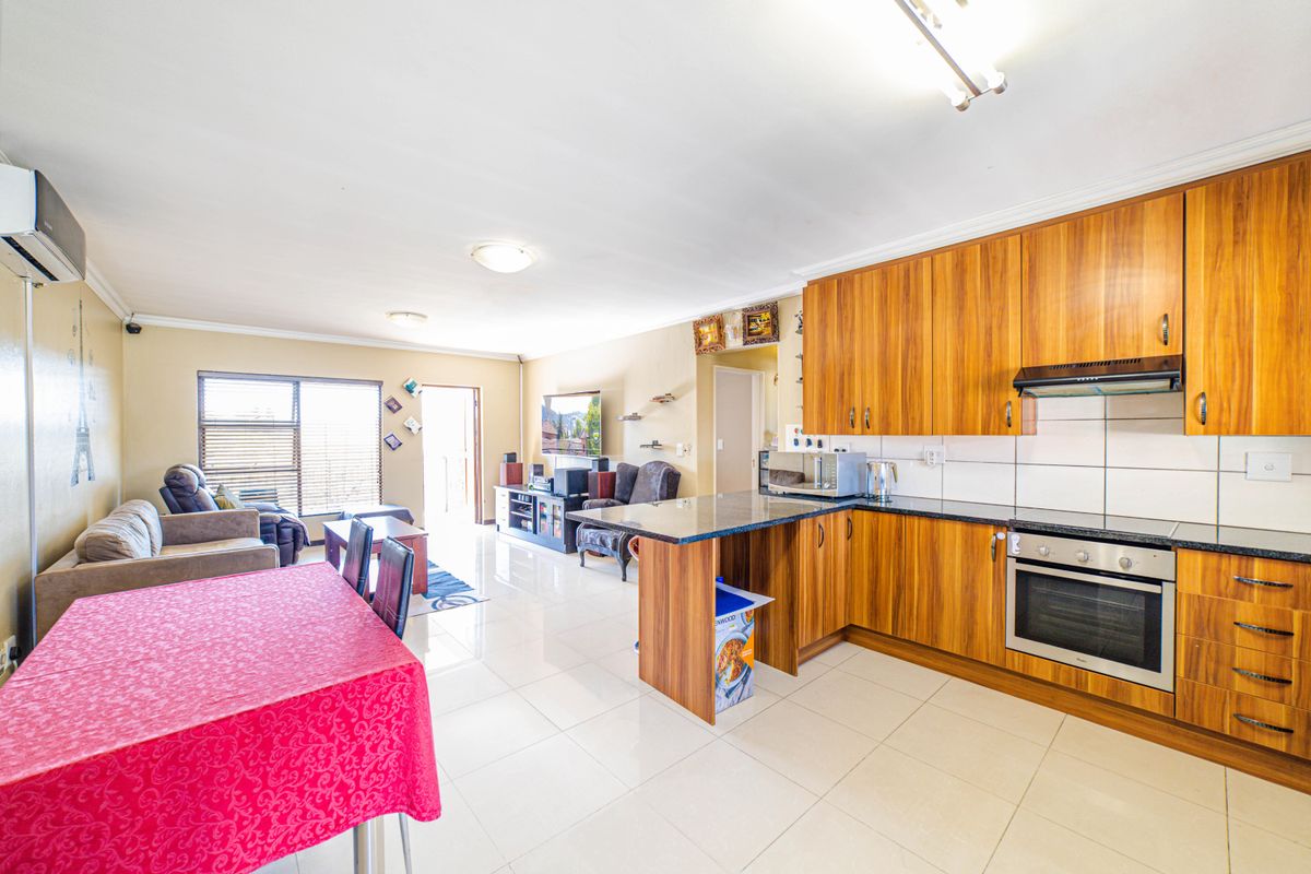 Step into elevated living with this beautifully positioned top-floor apartment in Olive Grove, Barbe - Photo 2