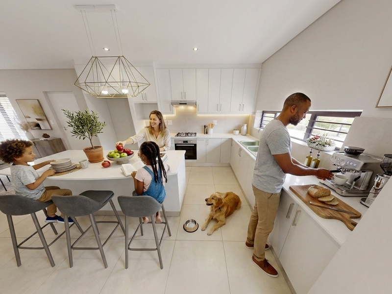 Modern open-plan kitchen featuring a central island, sleek white cabinetry, integrated appliances, and high-quality tiled flooring, creating a bright and functional living space.