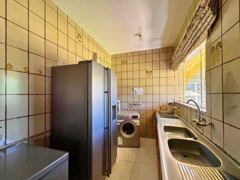 Expansive 8-Bedroom Family Home with Borehole & Development Potential - Photo 10