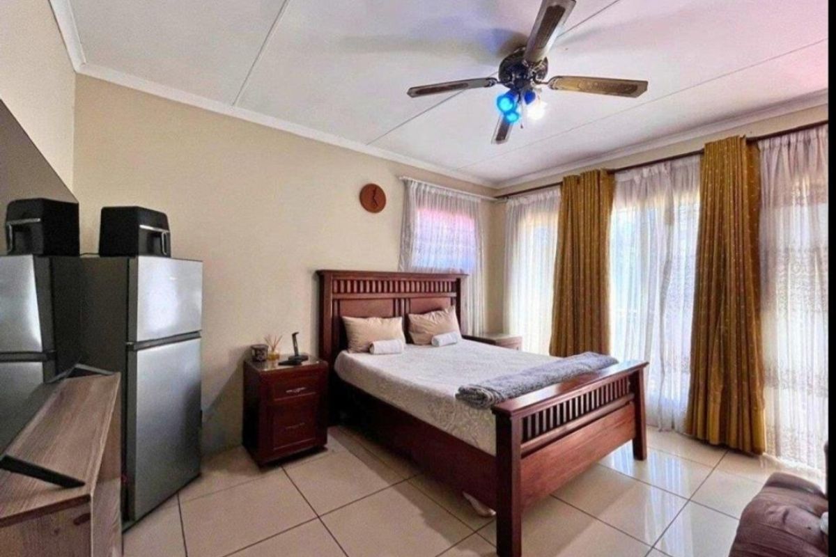 Expansive 8-Bedroom Family Home with Borehole & Development Potential - Photo 5