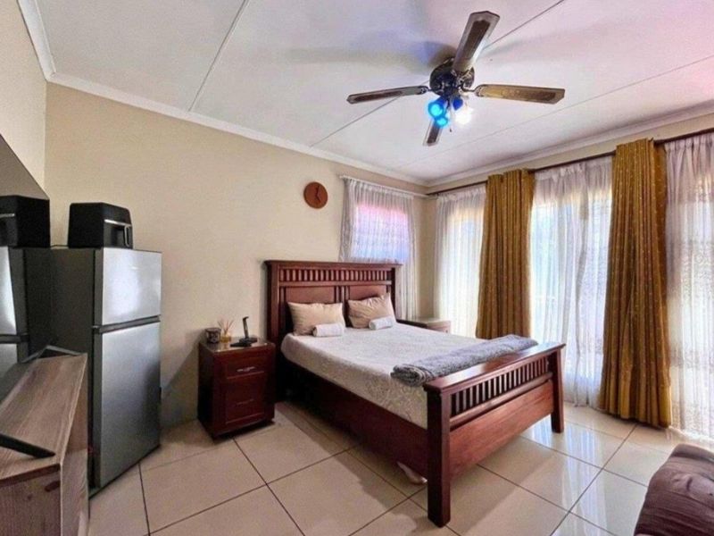 Expansive 8-Bedroom Family Home with Borehole & Development Potential - Photo 5