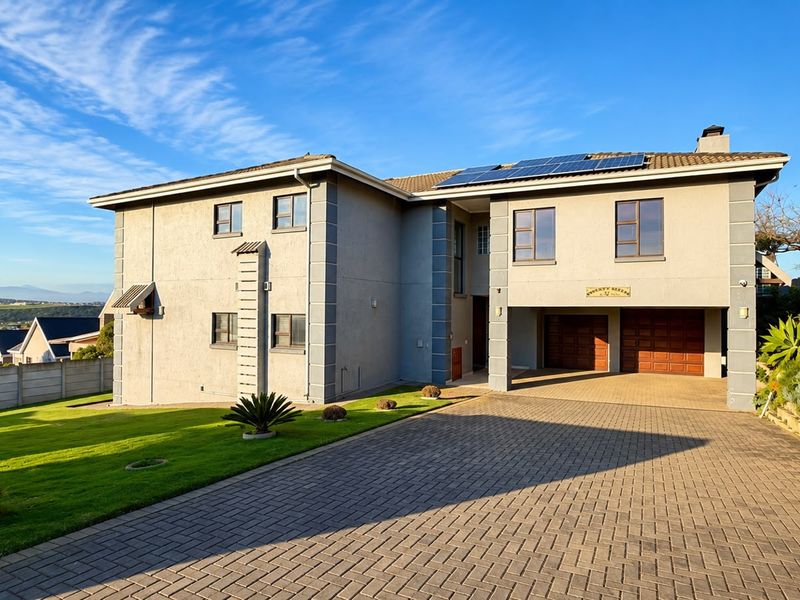 A well-maintained double-story residence featuring a paved driveway, double garage, and roof-mounted solar panels set within a landscaped garden.
