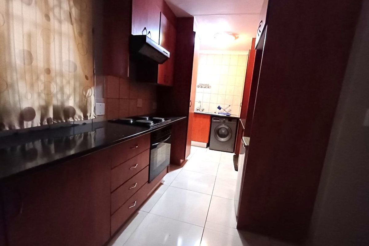 Modern Comfort and Convenience in a Secure Complex - Photo 3