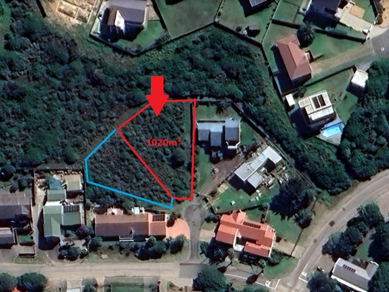 Aerial view of a 1020m2 vacant residential plot situated within an established suburban neighborhood, featuring dense natural vegetation and clear boundary markings.