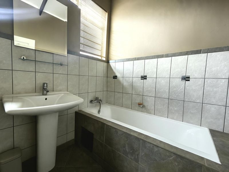 Spacious Modern Haven with Big Yard in Secure Gated Complex - Photo 8