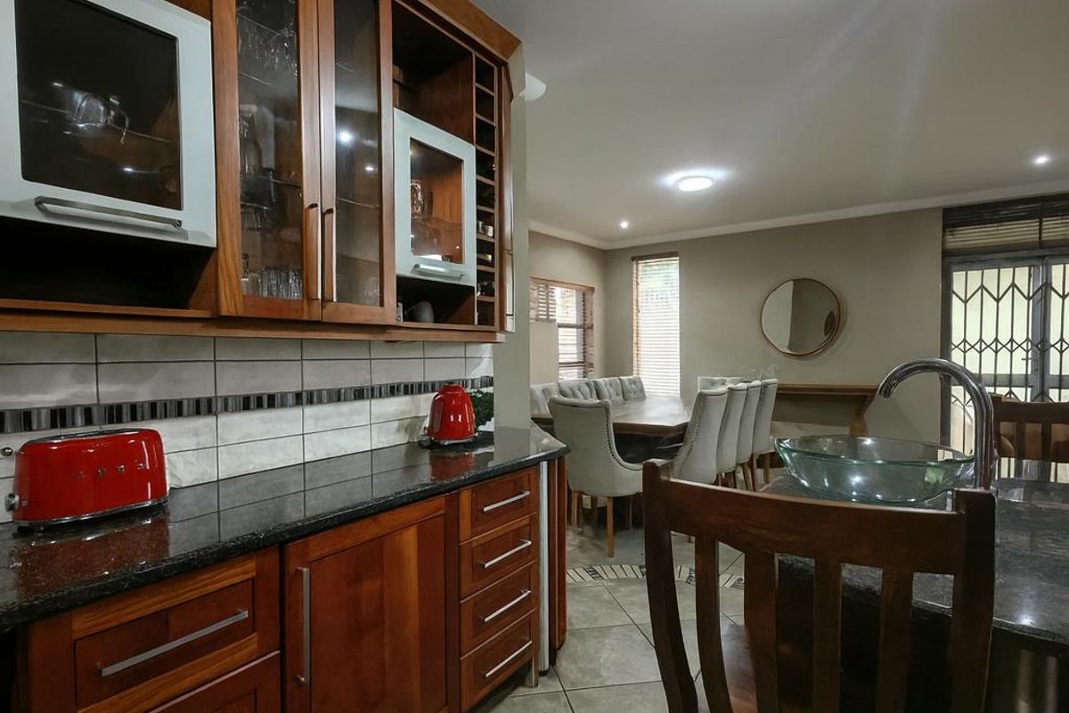 Spacious Modern Haven with Big Yard in Secure Gated Complex - Photo 3