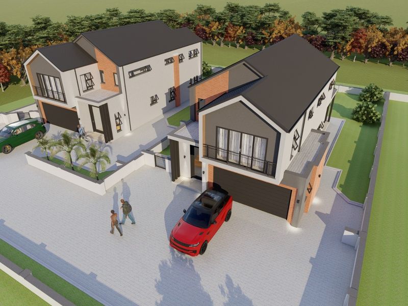 An aerial perspective of a modern residential development featuring two contemporary houses with paved driveways and double garages.