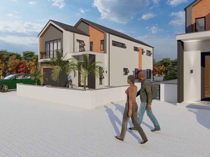 A modern two-story residential property featuring a brick and render facade, balcony, and paved driveway area.