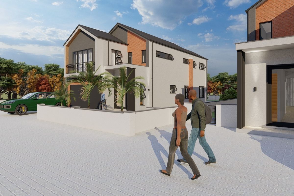 A modern two-story residential property featuring a brick and render facade, balcony, and paved driveway area.