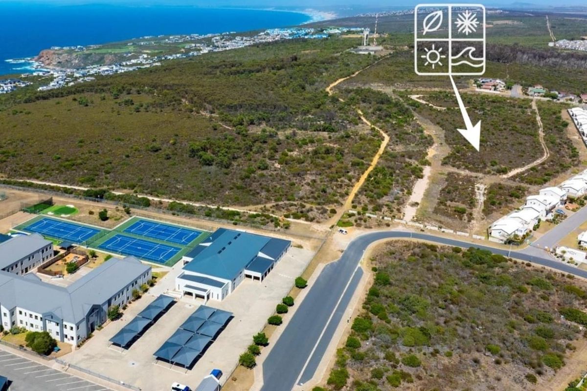 Aerial view of the estate showing surrounding infrastructure, tennis courts, paved roads, and proximity to the coastline.