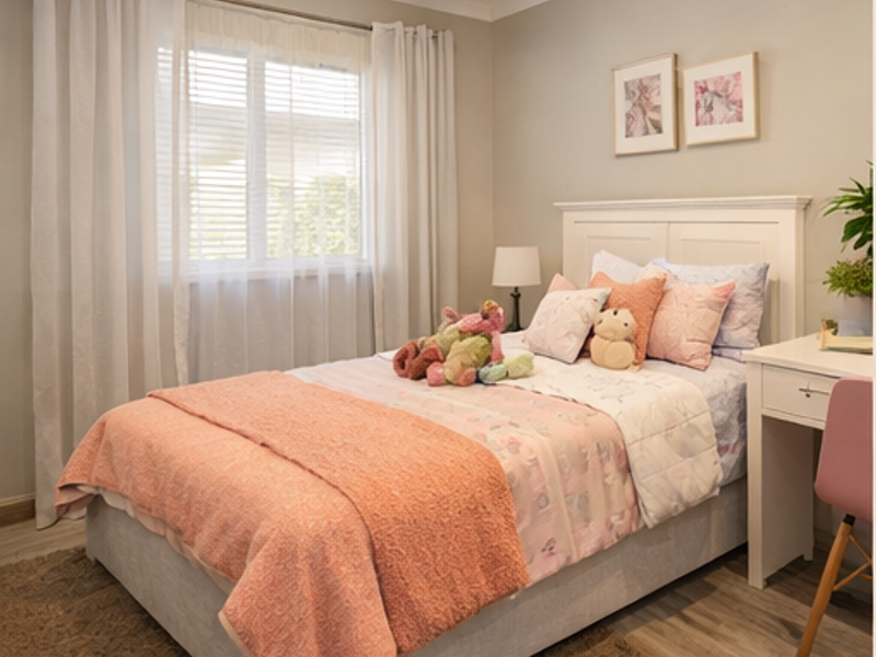A well-maintained bedroom featuring neutral wall tones, recessed downlighting, and venetian blinds, providing a comfortable and bright living space.