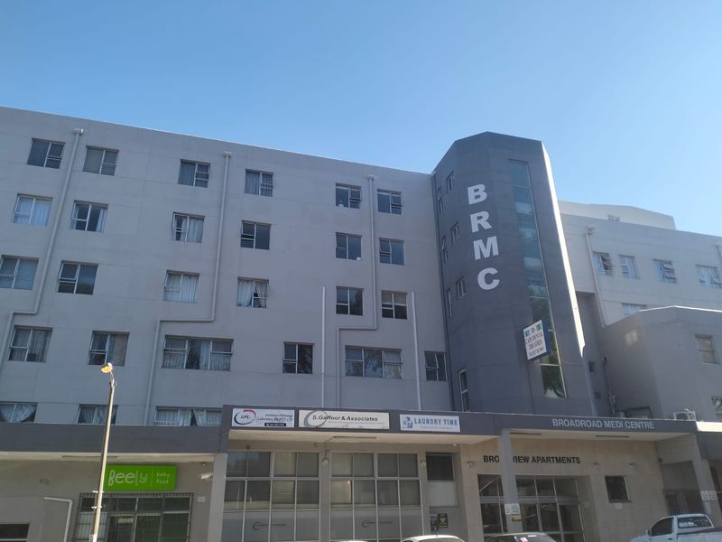 Exterior view of the Broadroad Medi Centre building, featuring a multi-story facade with ground-level commercial units and signage.