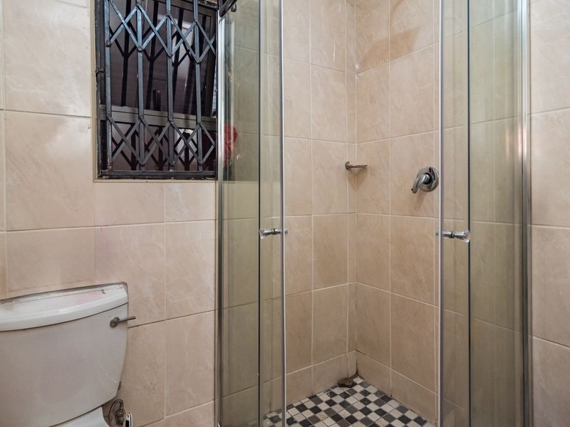 Neat 2-Bedroom Freehold Home with Solar Backup in Fleurhof Ext 2 - Photo 7