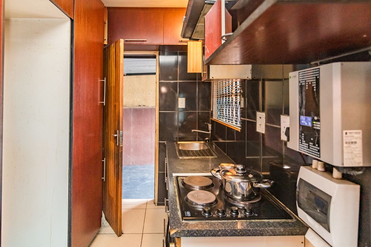 Neat 2-Bedroom Freehold Home with Solar Backup in Fleurhof Ext 2 - Photo 2