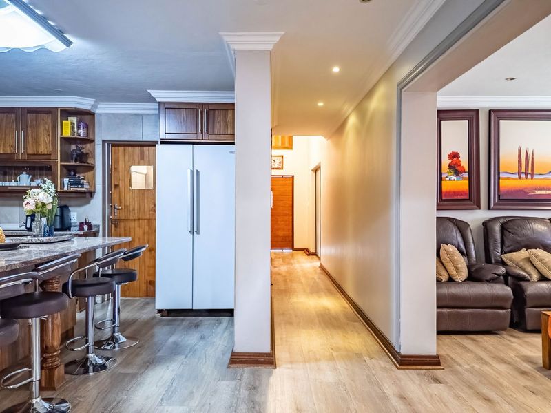 Versatile 4-Bedroom Double-Storey Home with Solar & 3 Garages in Bougainvillea Estate - Photo 8