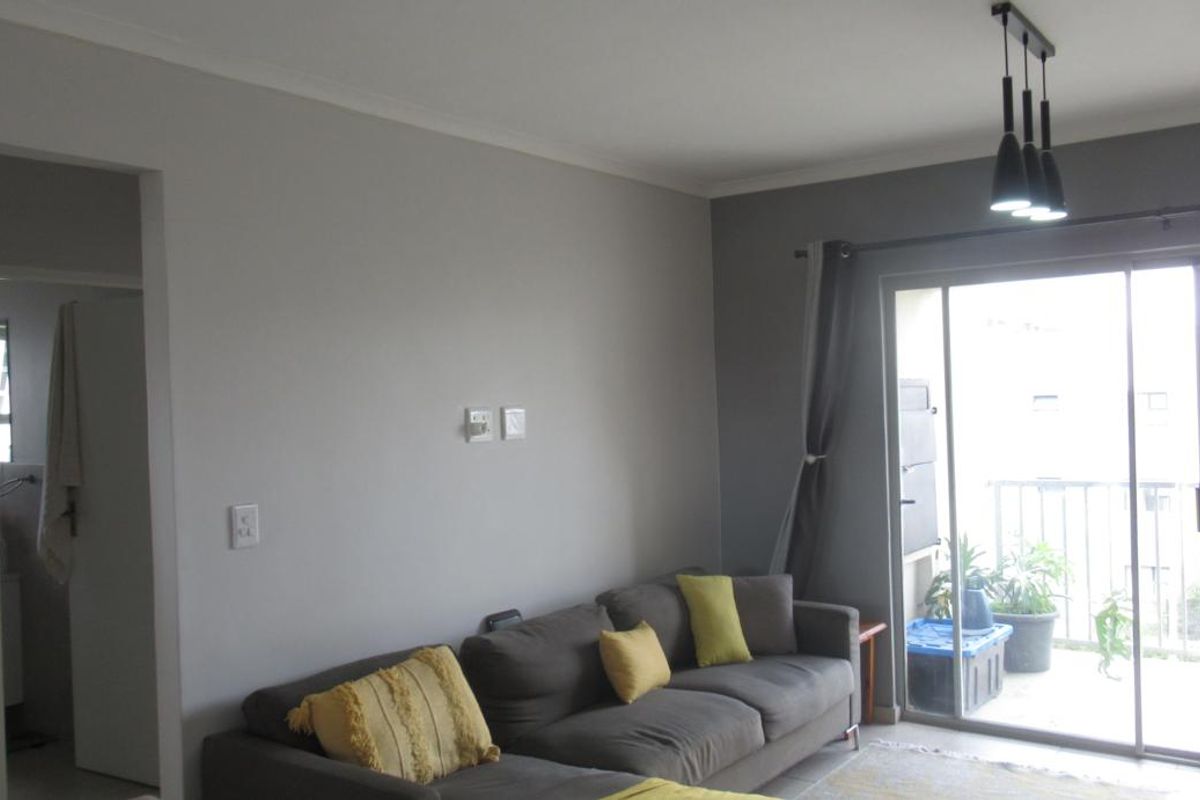 Modern First-Floor Apartment with Spacious Patio & Built-In Braai and Two Basement Parking bays - Photo 4
