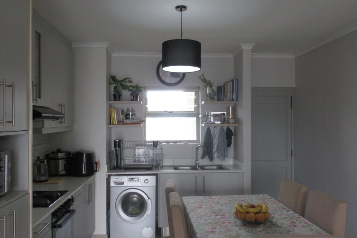 Modern First-Floor Apartment with Spacious Patio & Built-In Braai and Two Basement Parking bays - Photo 3