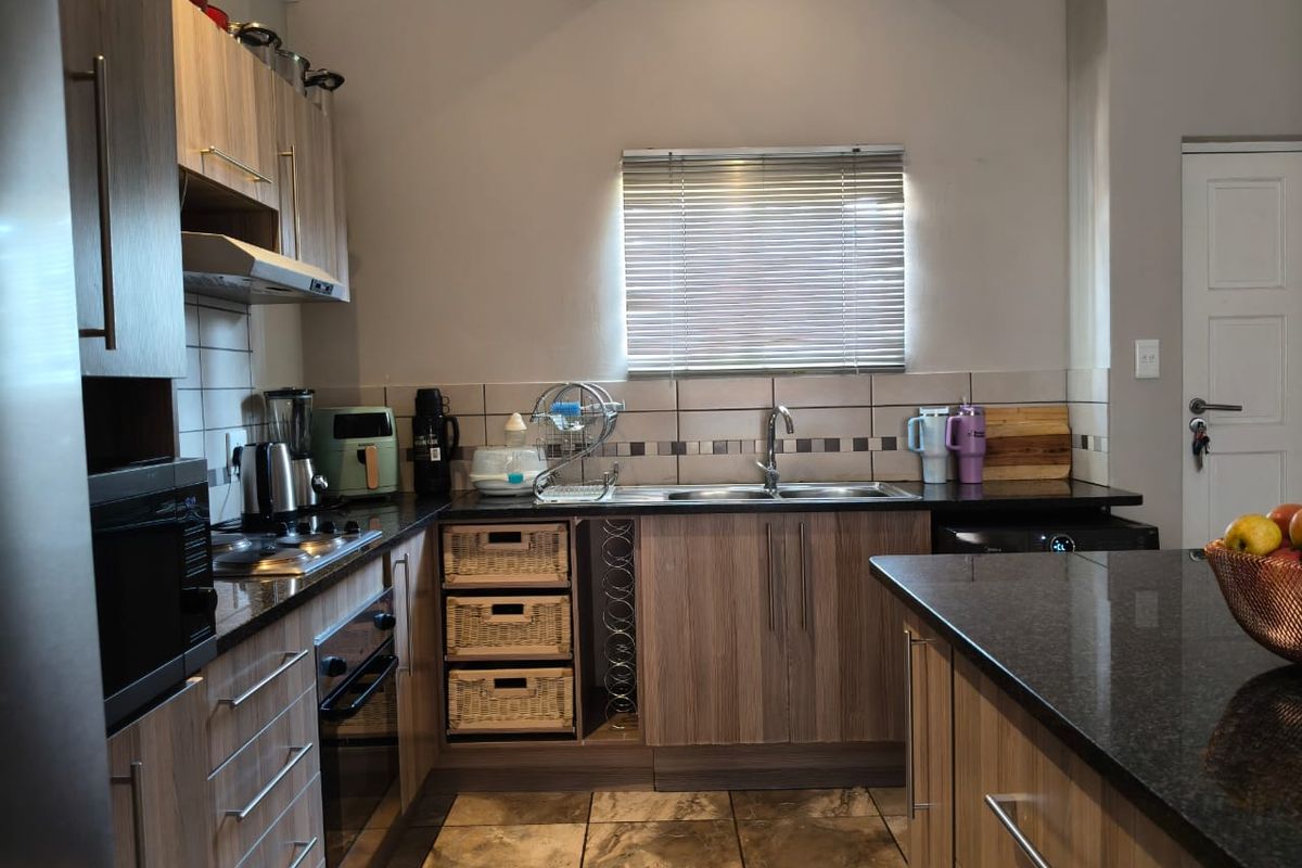 Experience luxury living in our modern 3-bedroom townhouse, nestled within a secure gated community! - Photo 3