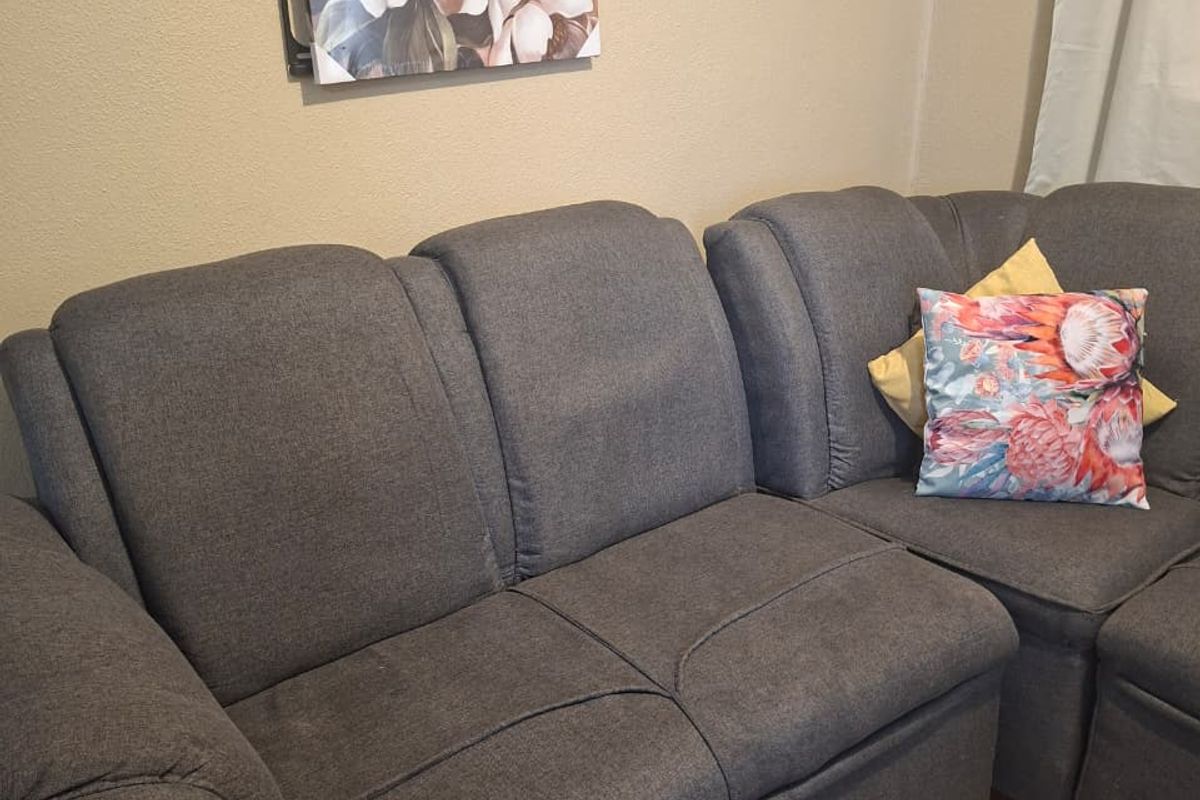A view of a living room area featuring neutral wall finishes.