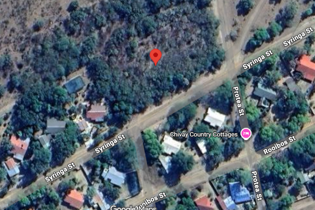 Aerial view of a vacant residential plot located at the intersection of Syringa Street and Protea Street.