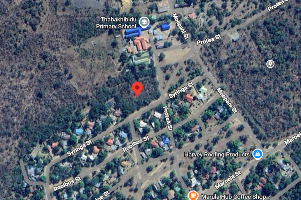 An aerial view showing the location of the vacant residential plot within the surrounding neighborhood and local infrastructure.