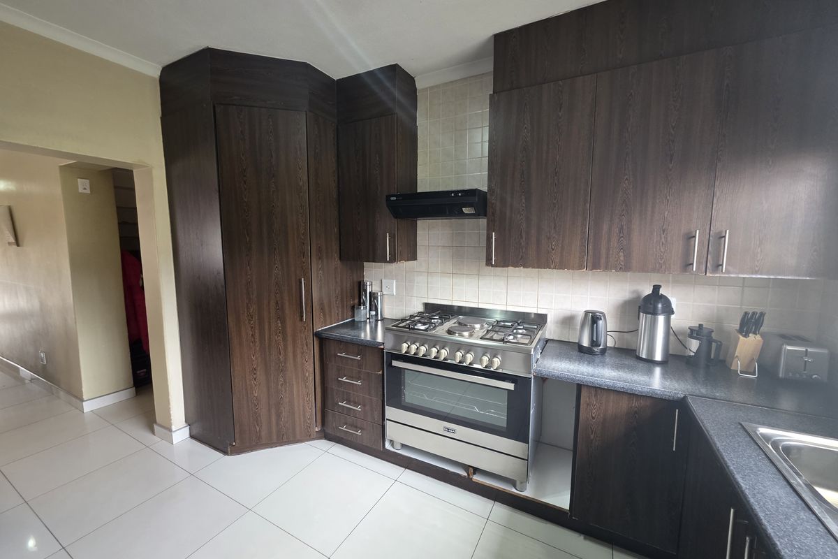 Modern Security Estate Living with Balconies, Built-in Braai & Airconditioning Throughout - Photo 3