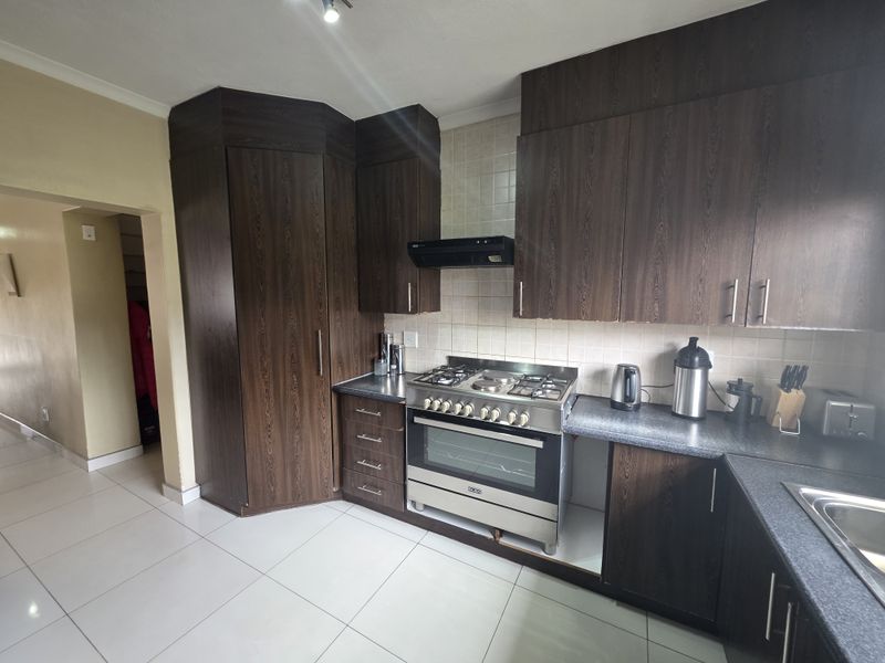 Modern Security Estate Living with Balconies, Built-in Braai & Airconditioning Throughout - Photo 3