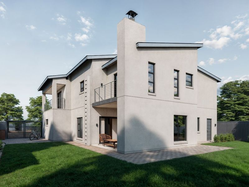 A modern two-story house exterior featuring a prominent chimney, upper-level balcony with metal railings, paved patio area, and a well-maintained garden.