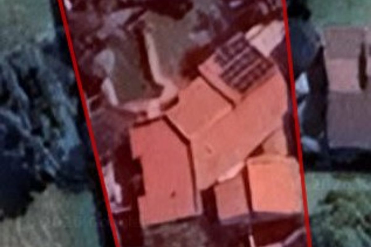 An aerial view of the property showing the roof structure and installed solar panels.